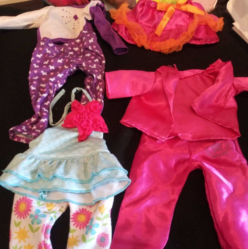 3 american doll outfits and 1 skirt